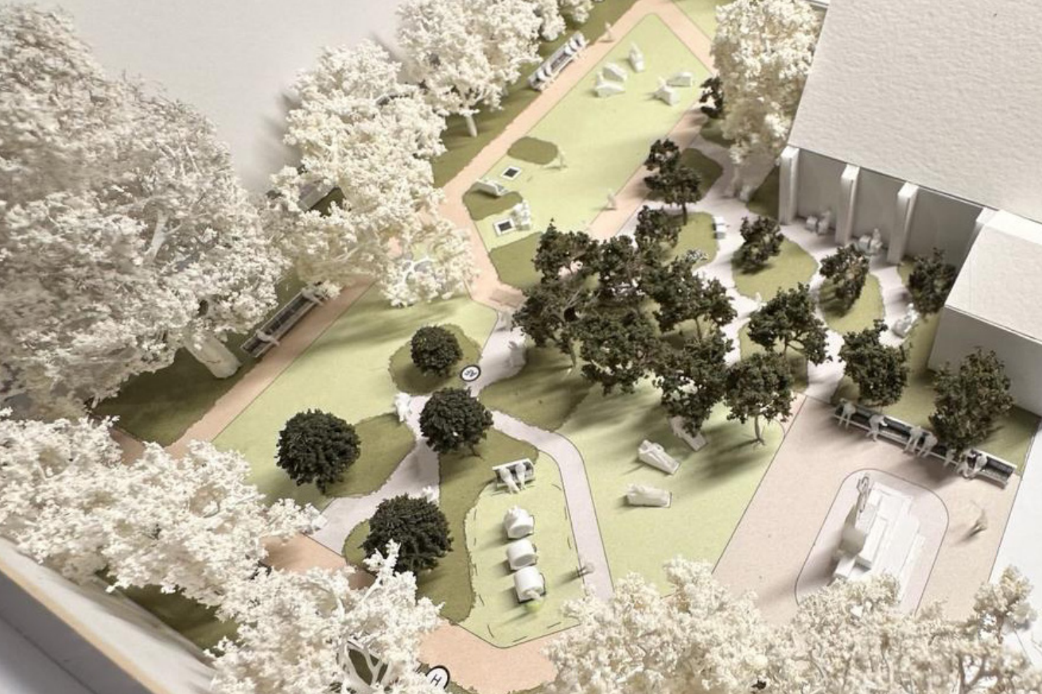 Image showing small scale model, with trees and seating, with pathways and grassed areas marked. 