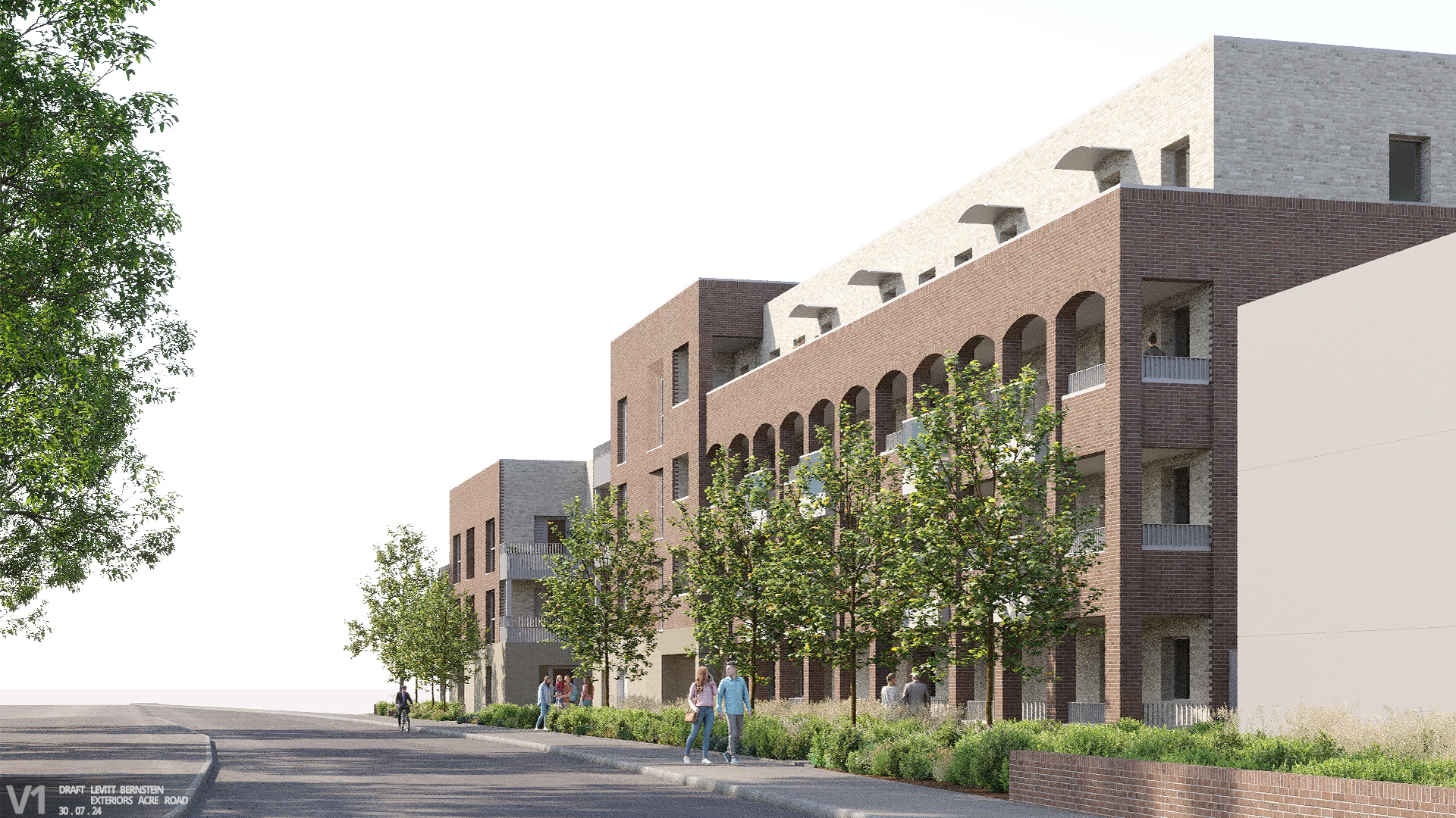 Image shows people walking on a pavement in front of grass, flowers and trees, and two brick buildings with balconies.